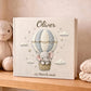 Personalized elephant baby memory album with hot air balloon design, custom name and optional birth date. A neutral nursery keepsake and timeless newborn photo book.