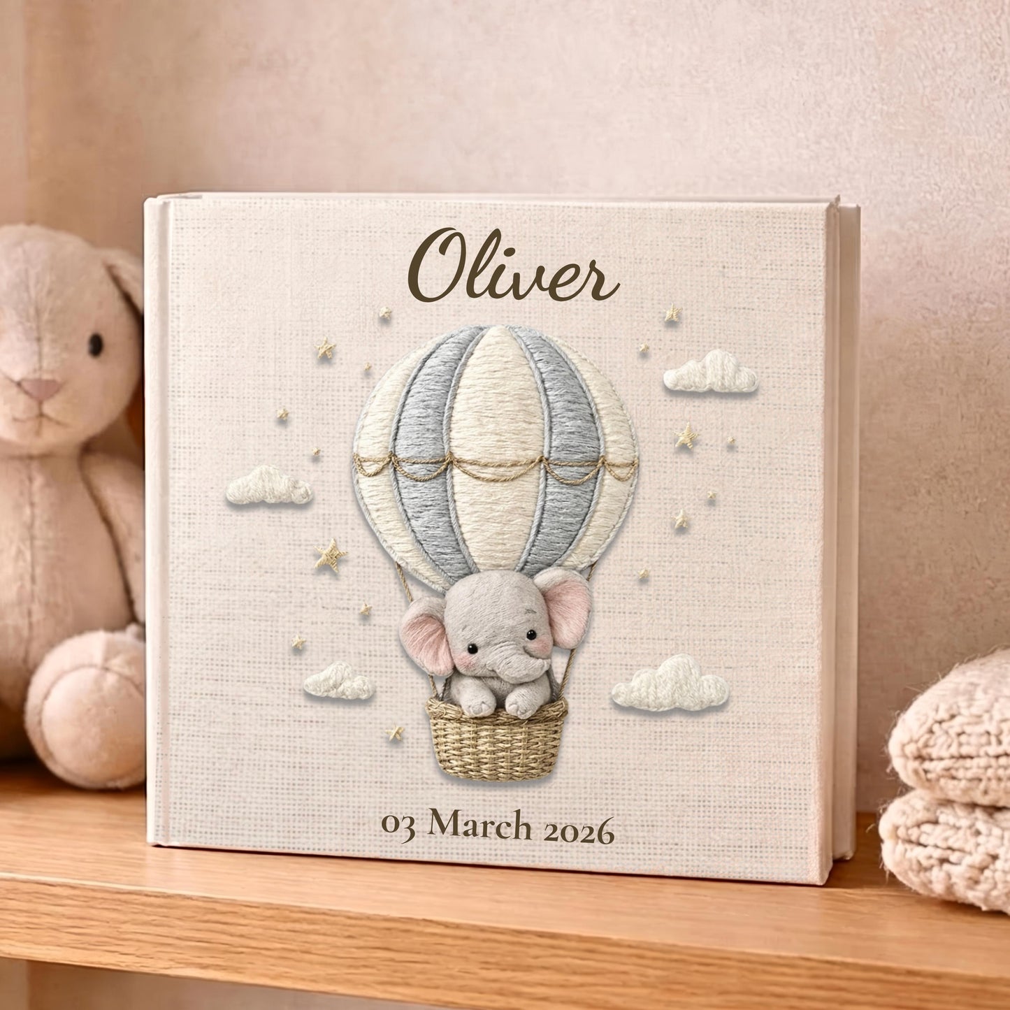 Personalized elephant baby memory album with hot air balloon design, custom name and optional birth date. A neutral nursery keepsake and timeless newborn photo book.