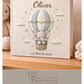 Personalized elephant baby memory album with hot air balloon design, custom name and optional birth date. A neutral nursery keepsake and timeless newborn photo book.