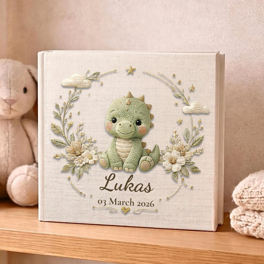 Personalized dinosaur baby memory book with name and birth date. A playful dino nursery photo album for baby memories and milestones.