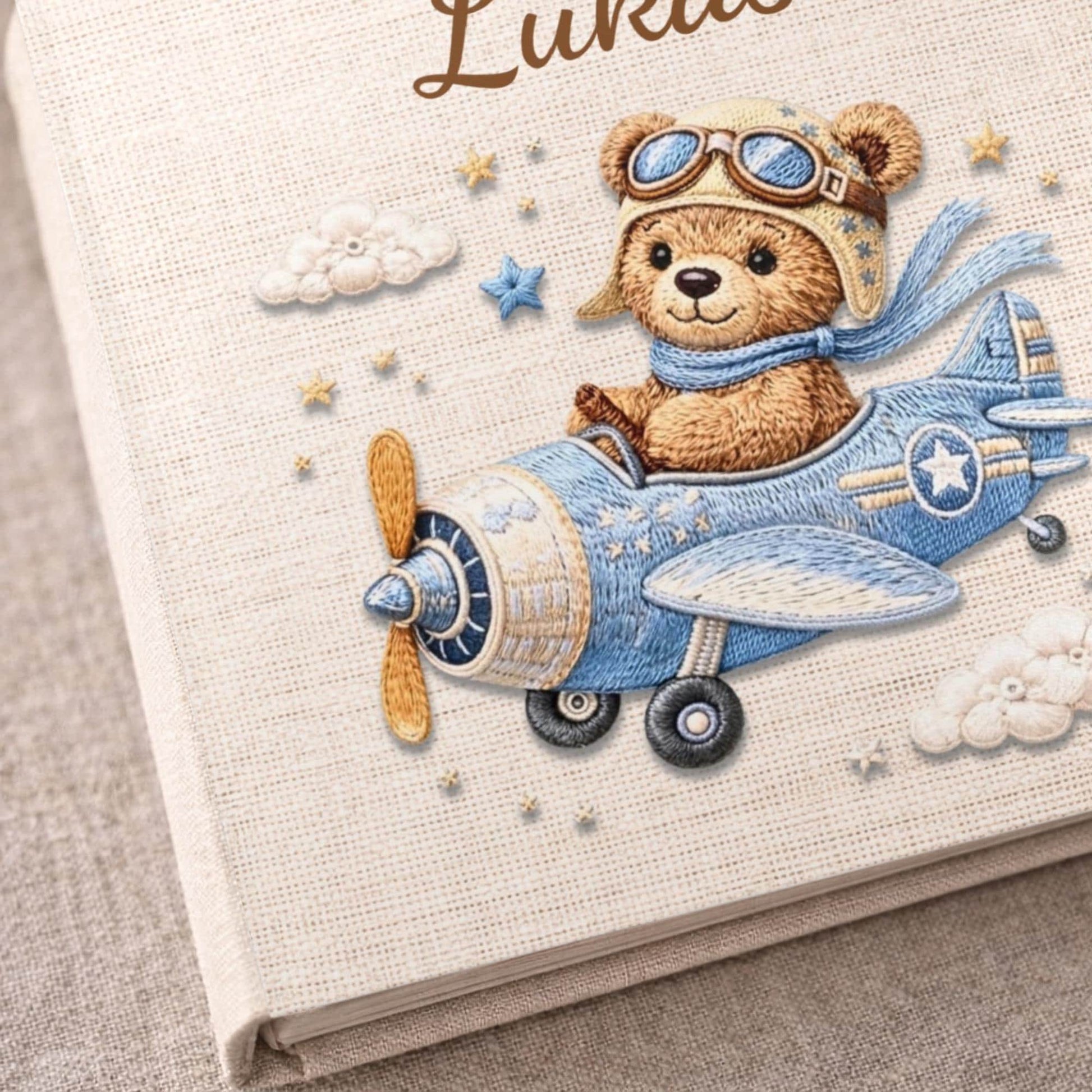 Personalized teddy bear airplane baby memory book with name and birth date. A soft aviation nursery album for first memories and milestones.