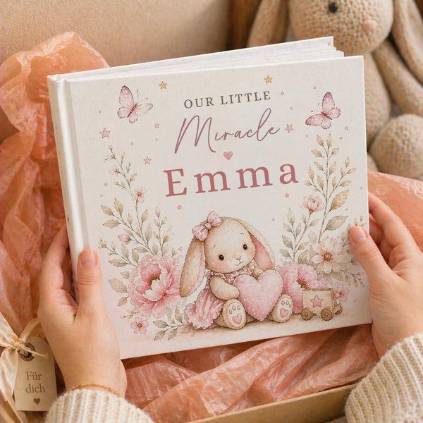 This baby memory book helps you capture the moments that matter most — from first smiles to first steps.
Featuring a bunny holding a heart, this design adds an extra layer of warmth, making it a meaningful gift for new parents.
