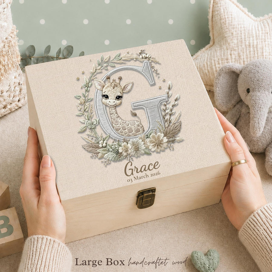 This newborn keepsake box is designed to hold your baby’s most treasured memories. A meaningful gift that helps parents keep every special moments in one place.

Crafted from wood with a soft neutral look, this box features a delicate giraffe illustration with letter G. The embroidery-style artwork adds a refined and timeless touch.