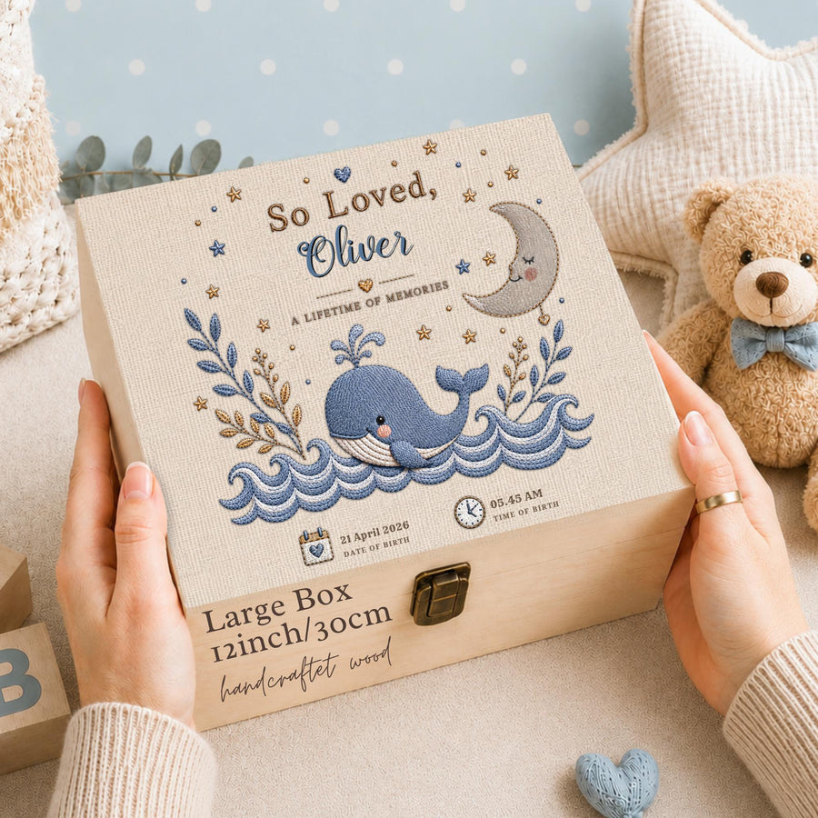 This stunning large wooden keepsake box (30cm / 12 inch) is made for a baby boy destined for great things. A full-color design printed directly onto the handcrafted wood features a chubby blue whale splashing through ocean waves, a sleepy crescent moon, delicate botanical sprigs, and gold and navy stars — all in a beautiful nautical palette of slate navy, cream, and warm gold.
Personalized with baby's name, exact date of birth, and time of birth.