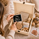 This stunning large wooden keepsake box (30cm / 12 inch) is made for a baby boy destined for great things. A full-color design printed directly onto the handcrafted wood features a chubby blue whale splashing through ocean waves, a sleepy crescent moon, delicate botanical sprigs, and gold and navy stars — all in a beautiful nautical palette of slate navy, cream, and warm gold.
Personalized with baby's name, exact date of birth, and time of birth.