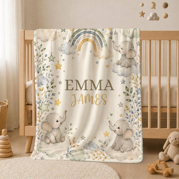 personalized elephant rainbow blanket. Featuring adorable watercolor elephants, fluffy clouds, delicate florals, stars, and a pastel rainbow, this custom blanket creates a calm and beautiful nursery atmosphere while becoming a cherished keepsake for years to come.