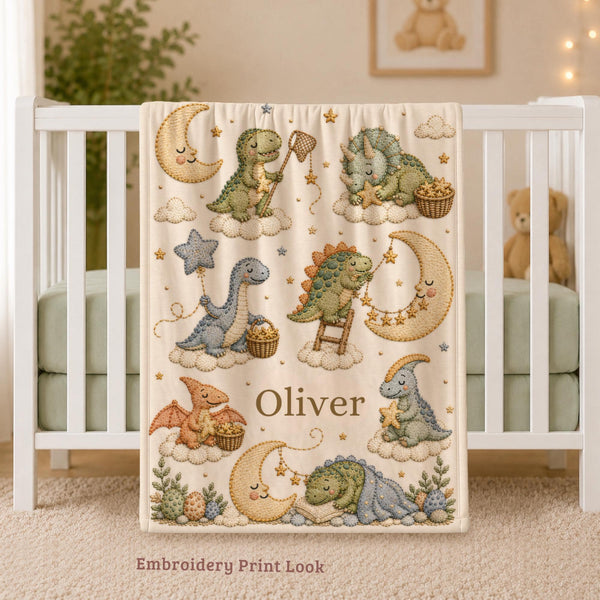 Personalized Dinosaur Baby Blanket featuring an embroidered-look print with adorable dinosaurs, sleepy moons, fluffy clouds, and twinkling stars.