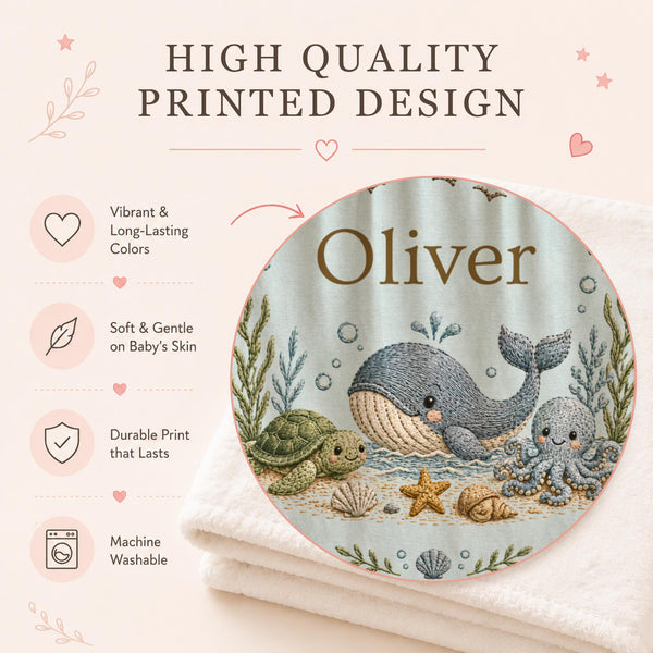 Personalized Ocean Baby Blanket with an embroidered-look print featuring a whale, dolphin, sea turtle, octopus, and coastal details.