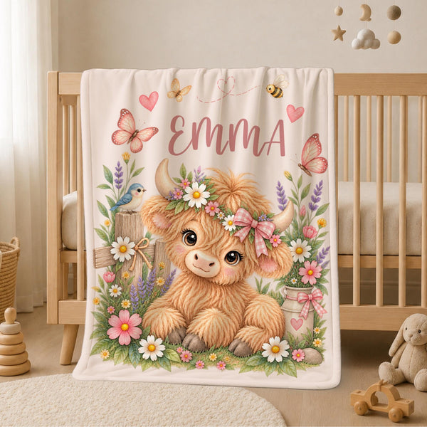 Personalized Highland Cow Baby Blanket featuring an adorable fluffy Highland cow surrounded by delicate wildflowers, butterflies, hearts and charming cottage garden details. Customized with your baby’s name, this sweet floral blanket makes a beautiful addition to a baby girl nursery and a meaningful keepsake for a new arrival.