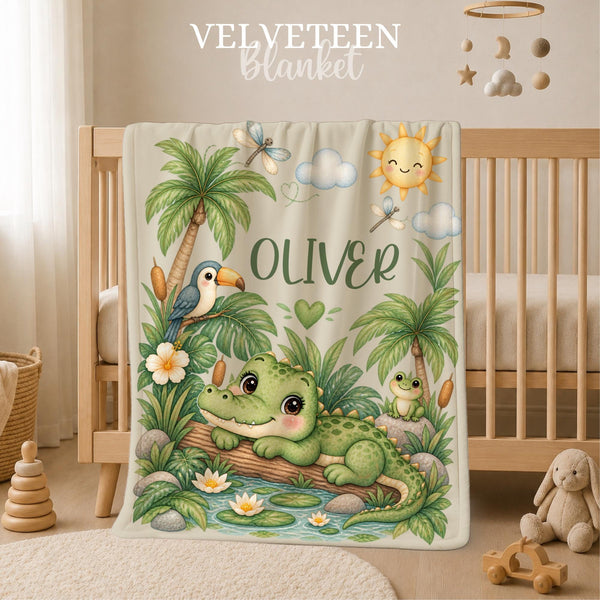 Personalized Crocodile Baby Blanket featuring an adorable little crocodile relaxing beside a tropical pond surrounded by palm trees, lush greenery, water lilies, a toucan, frog, dragonflies and a smiling sunshine. Customized with your baby’s name, this sweet jungle-inspired blanket makes a charming addition to a baby boy nursery and a meaningful keepsake for a new arrival.