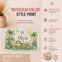 Personalized Crocodile Bento Lunch Box featuring a charming watercolor fine art print with a sweet crocodile, tropical palm trees, a toucan, frog, dragonflies, water lilies and a smiling sun. Customized with your child’s name, this practical kids lunchbox is perfect for daycare, preschool, kindergarten, school, picnics and everyday adventures.
