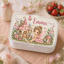 Personalized Fairy Bento Lunch Box featuring a dreamy watercolor fine art print with a sweet little fairy, magical flower cottage, butterflies, mushrooms and a whimsical enchanted garden filled with delicate flowers. Customized with your child’s name, this practical kids lunchbox is perfect for daycare, preschool, kindergarten, school, picnics and everyday adventures.