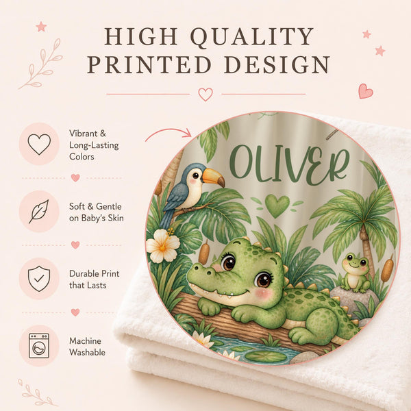 Personalized Crocodile Baby Blanket featuring an adorable little crocodile relaxing beside a tropical pond surrounded by palm trees, lush greenery, water lilies, a toucan, frog, dragonflies and a smiling sunshine. Customized with your baby’s name, this sweet jungle-inspired blanket makes a charming addition to a baby boy nursery and a meaningful keepsake for a new arrival.