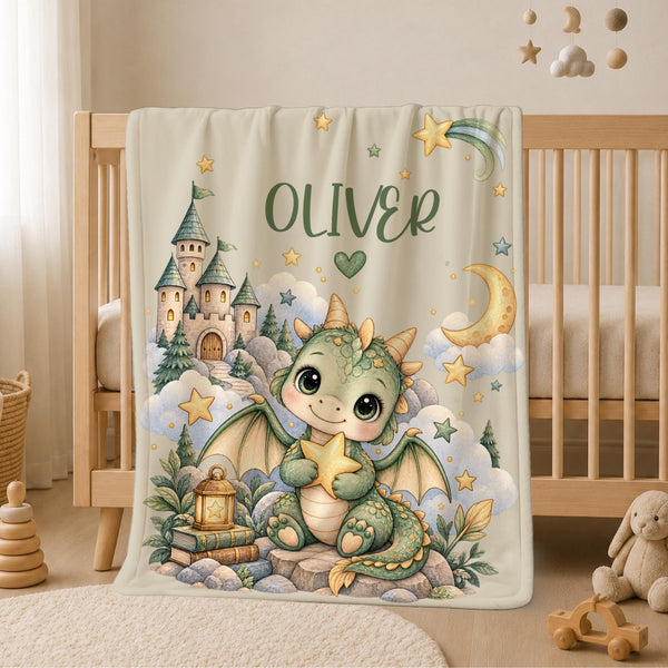Personalized Dragon Baby Blanket with Name featuring an adorable baby dragon surrounded by a magical castle, crescent moon, shooting stars, clouds and an enchanting fantasy landscape.