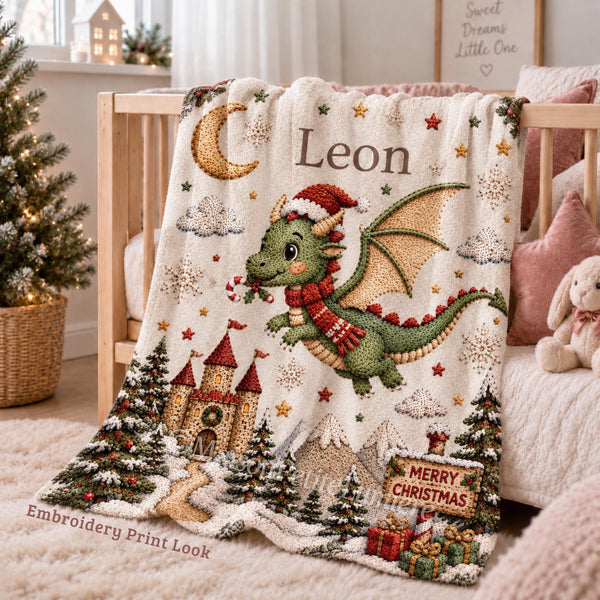 Personalized Christmas Dragon Baby Blanket with an embroidered-look print featuring a cute baby dragon in a Santa hat and scarf, magical Christmas castle, snowy trees, candy cane, moon, stars, presents and winter mountain scenery.
A beautiful personalized holiday blanket for babies and children, perfect for Baby’s First Christmas, newborn gifts, Christmas baby showers and magical holiday nursery moments.
