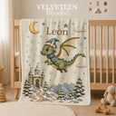 Personalized Dragon Baby Blanket with an embroidered-look print featuring a cute baby dragon in a winter hat and scarf, magical snow-covered castle, moon, stars, snowy mountains and winter forest scenery.

A beautiful personalized blanket for babies and children, perfect for baby showers, newborn gifts, winter babies, birthdays and magical winter nursery spaces.