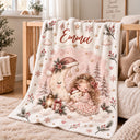Personalized baby blanket with a girl in a pink dress cuddling a star beside a sleeping crescent moon in a Santa hat.