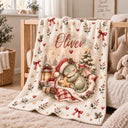 Personalized baby blanket with a sleeping dragon in a Santa hat under a checked quilt, with a lantern, gifts and holly.