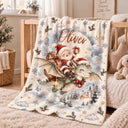 Personalized baby blanket showing Santa riding a green dragon over a snowy castle in a moonlit sky, with a lantern and bell.