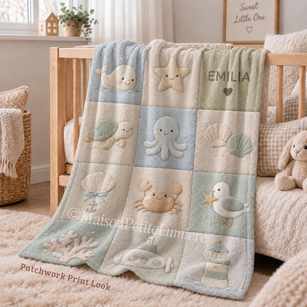 Personalized patchwork look baby blanket with name, crab, whale and octopus in a soft underwater quilt design. Cozy newborn blanket and baby gift.
