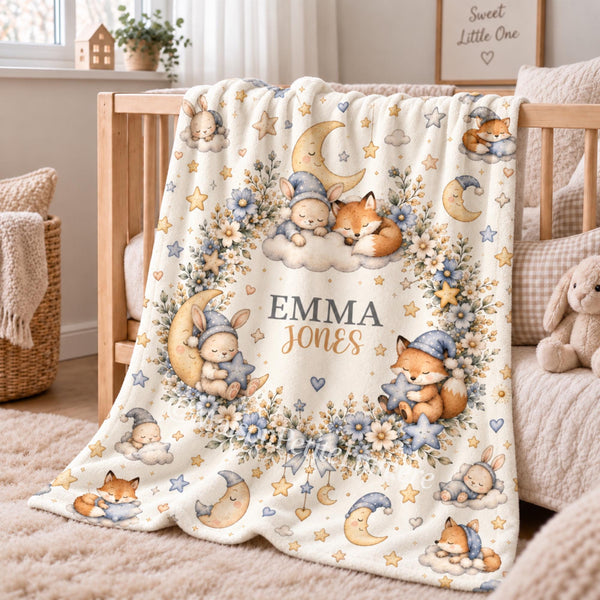 Personalized bunny and fox baby blanket featuring adorable watercolor woodland animals, crescent moons, stars, clouds, and delicate floral details. Customized with your baby’s name, this woodland-themed blanket makes a beautiful nursery keepsake, baby shower gift, newborn present, or milestone photo prop. Perfect for creating a dreamy moonlit nursery inspired by sleepy bunnies, cuddly foxes, and timeless storybook charm.