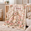 Personalized floral bunny baby blanket featuring a sleeping watercolor bunny in a flower crown, surrounded by blush pink blossoms, white daisies, soft green leaves and little hearts. Customized with your baby's name, this bunny blanket makes a beautiful nursery keepsake, baby shower gift, newborn present, Easter gift, or milestone photo prop.